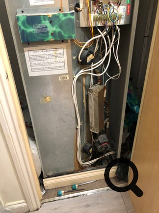 Pulsacoil 2000 replacement. Leaking Pulsacoil 2000 with front removed, showing rust marks from leaks